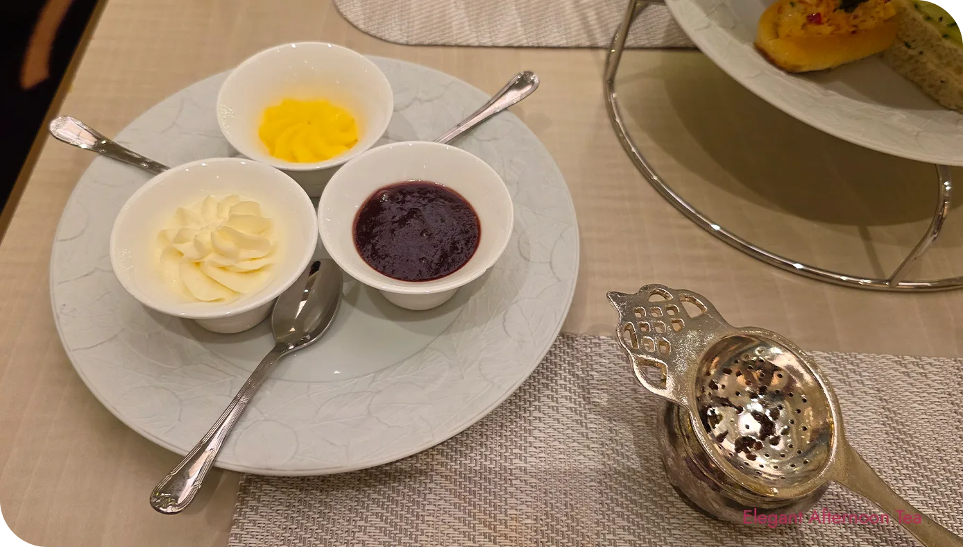 Double Devonshire cream, seasonal fruit preserves, and lemon curd served with scones at The St. Regis New York afternoon tea