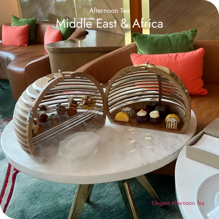 Afternoon tea setting in the Middle East and Africa with elegant pastries, teaware, and a refined lounge table presentation.