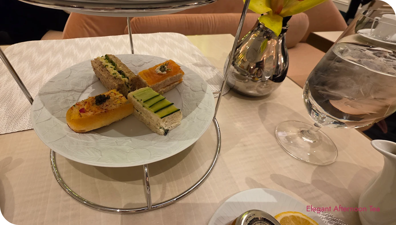 Close-up of savory bites on the tiered stand at St. Regis New York Ladurée afternoon tea