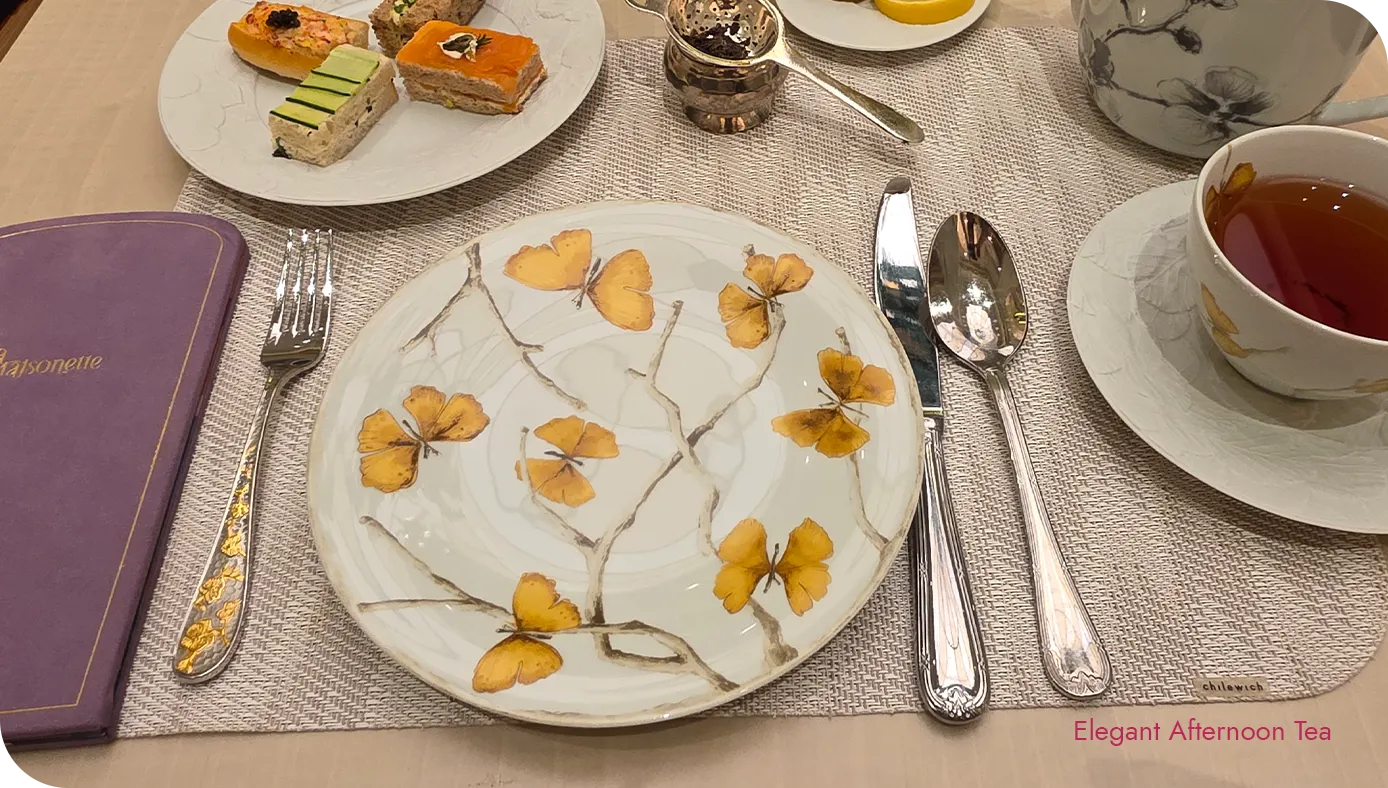Butterfly-patterned china plate and teacup used for afternoon tea at The St. Regis New York