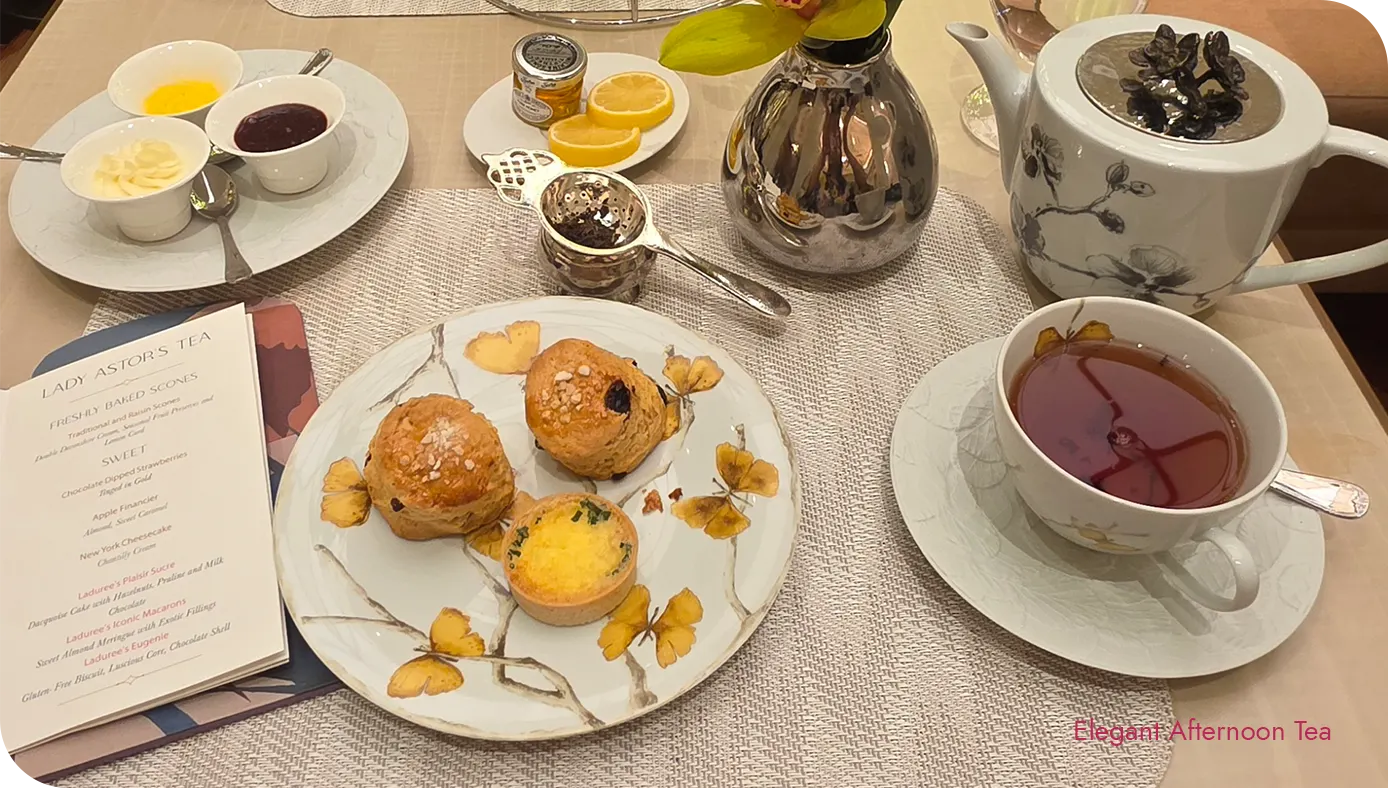 Traditional and raisin scones with teapot and tea service at The St. Regis New York afternoon tea