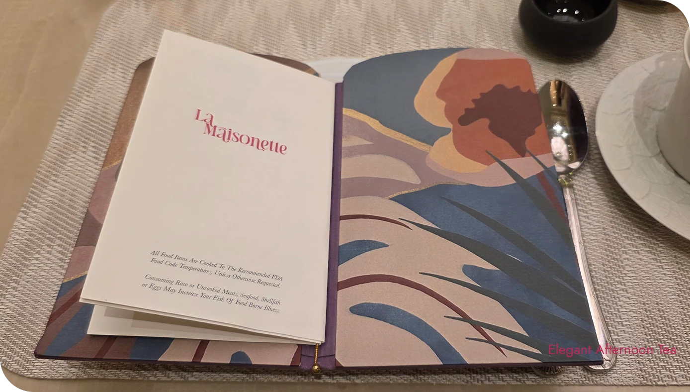 La Maisonette menu booklet on the table setting during afternoon tea service