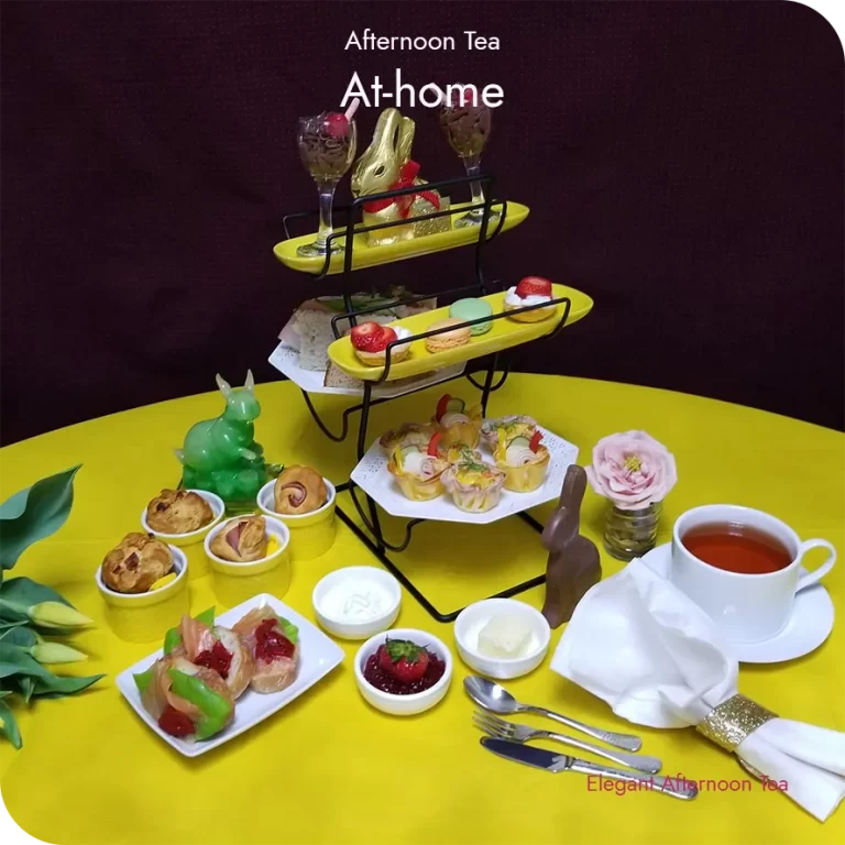 At-home afternoon tea arranged on a tray with small bites and teaware, prepared as a personal ritual.